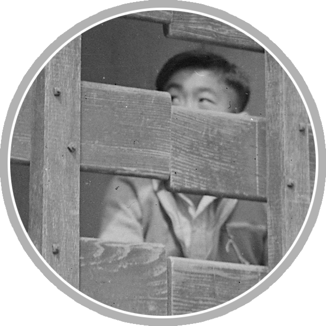 San Pedro, CA. Trucks filled with goods and children as last Redondo Beach residents of Japanese ancestry were moved to assembly center at Arcadia, CA. National Archives Identifier 536782